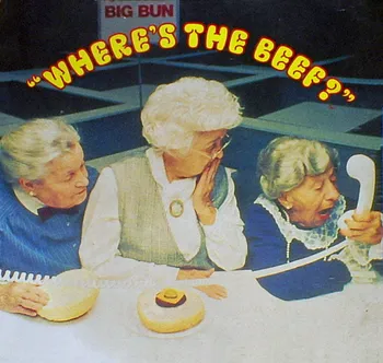 Three old women sitting at a table. One is screaming into a phone 'Where's the beef?'